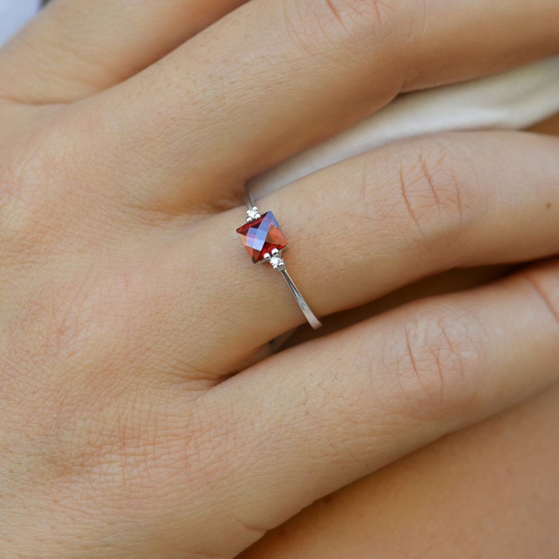 Ring with diamonds and garnet